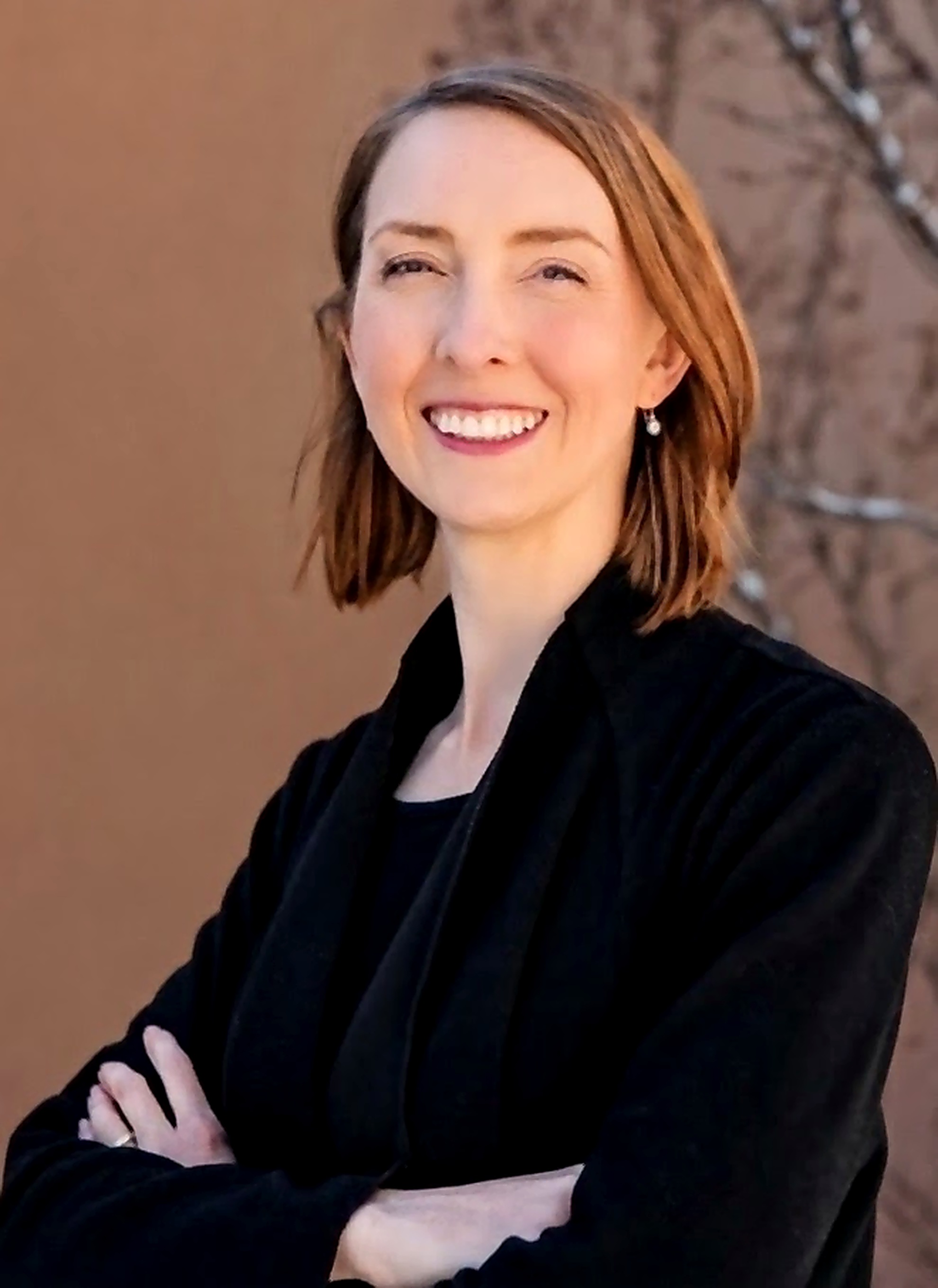 Camille Guzel, MD. Interim headshot — temporary until professional photos.