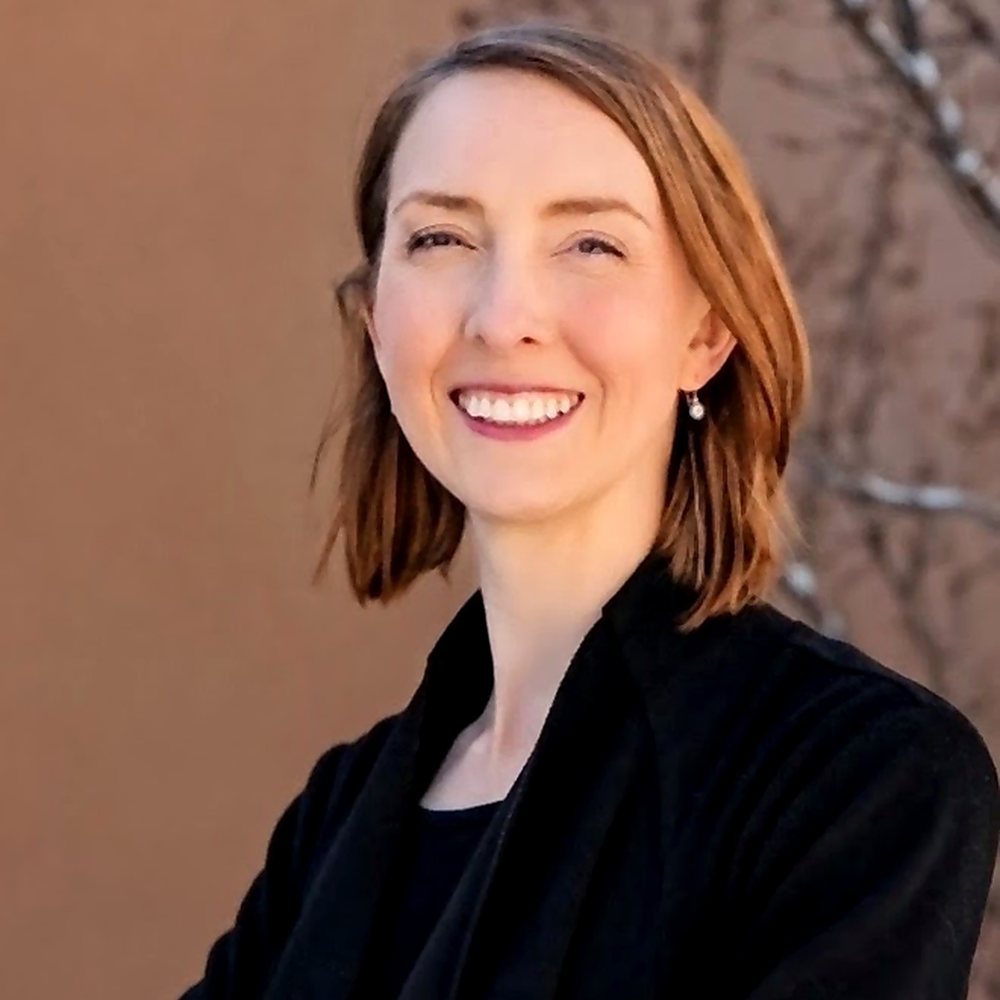 Camille Guzel, MD. Interim headshot — temporary until professional photos.